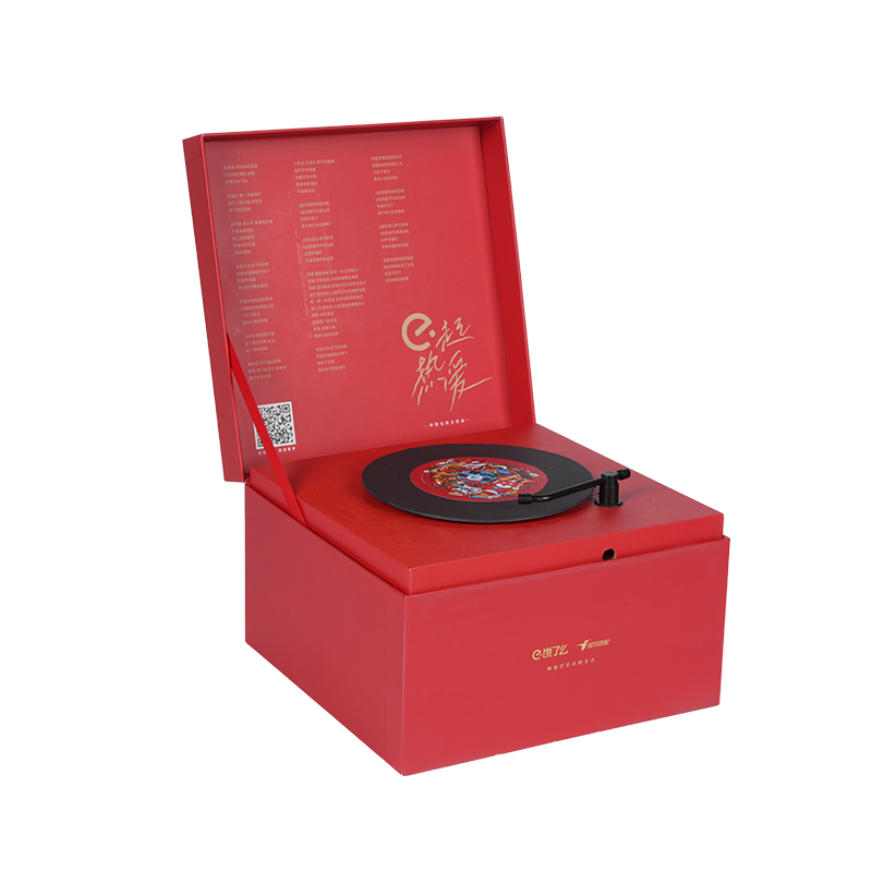 Harde, draaibare muziekdoos in boekvorm met kerstthema